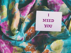 colorful silk scarf, words on white paper sticker i need you